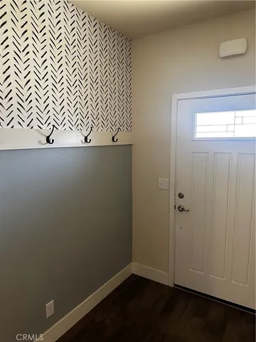 an empty room with wooden floor