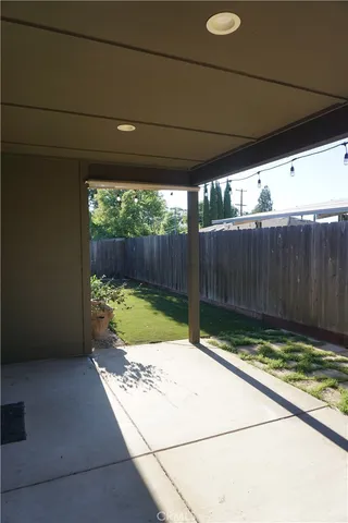 a view of small space with wooden fence