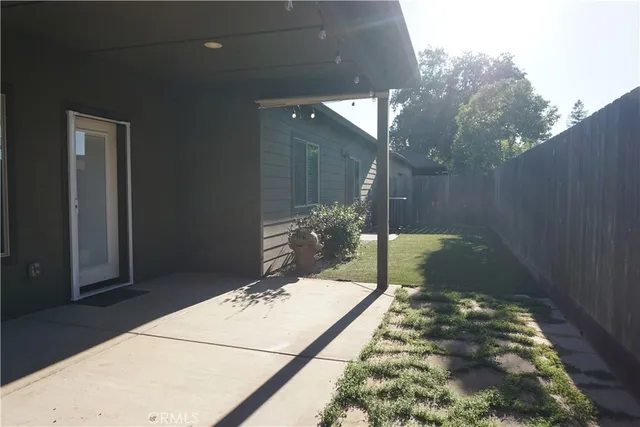 a view of a backyard with a patio