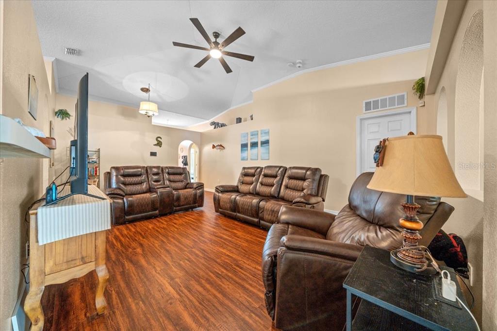 49 Hemlock Radial Loop Ocala, FL 34472 - Photo 11 of 50 a living room with furniture and a flat screen tv