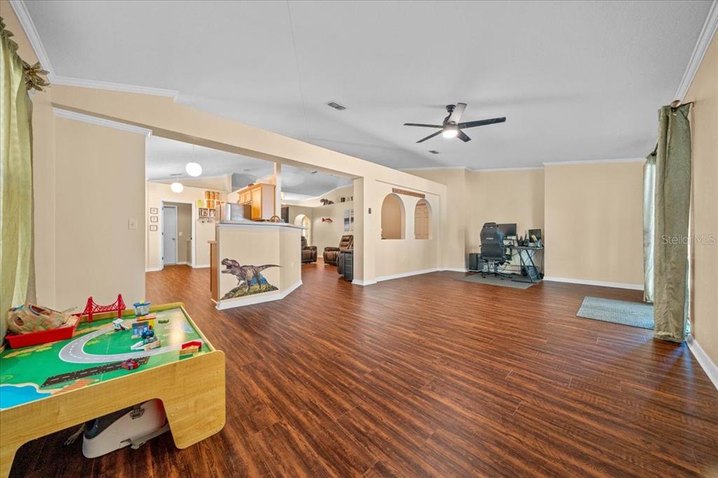 49 Hemlock Radial Loop Ocala, FL 34472 - Photo 19 of 50 a very nice looking room with wooden floor