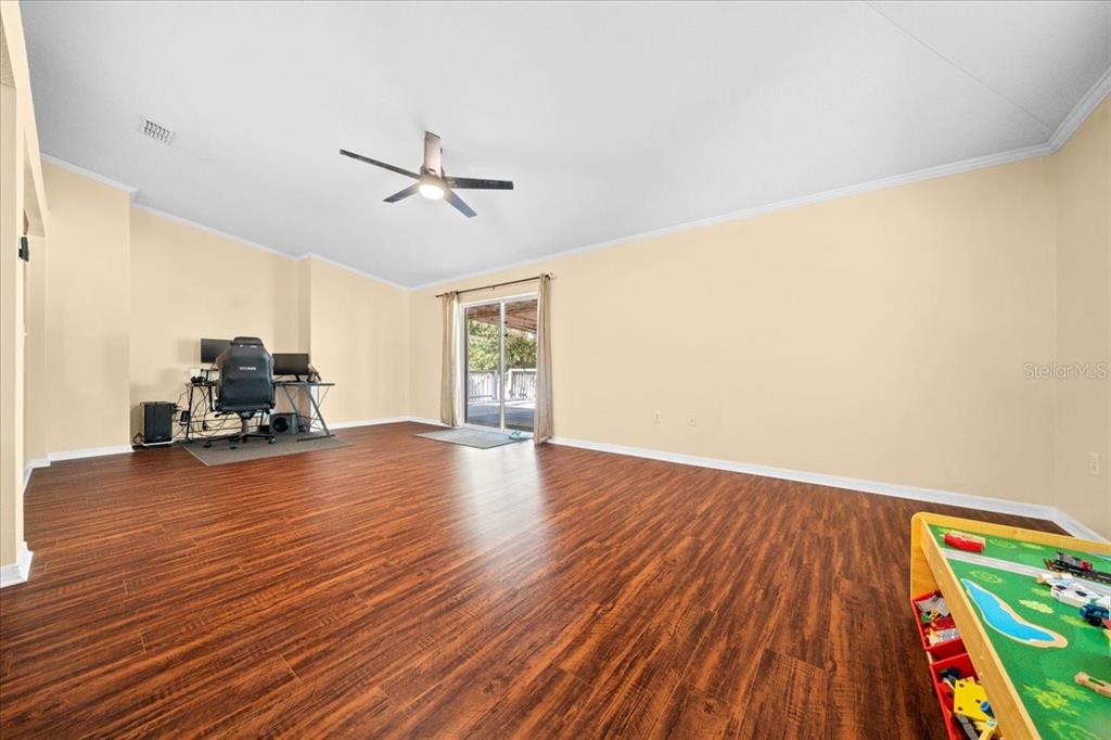 49 Hemlock Radial Loop Ocala, FL 34472 - Photo 21 of 50 a living room with furniture and a wooden floor