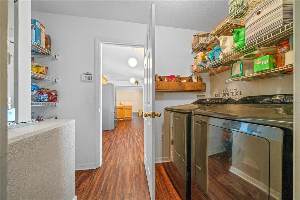49 Hemlock Radial Loop Ocala, FL 34472 - Photo 22 of 50 a kitchen with stainless steel appliances granite countertop a refrigerator and a stove