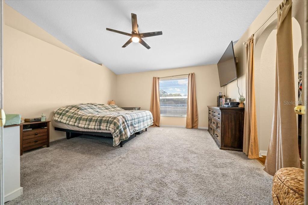 49 Hemlock Radial Loop Ocala, FL 34472 - Photo 23 of 50 a spacious bedroom with a bed and a cabinet