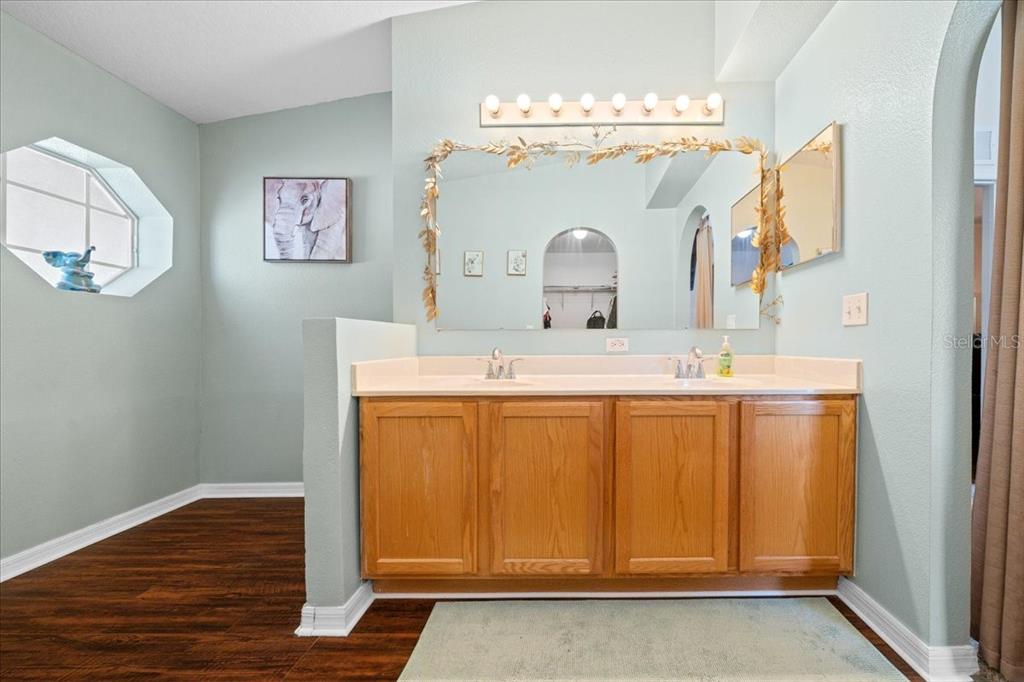 49 Hemlock Radial Loop Ocala, FL 34472 - Photo 27 of 50 a bathroom with a sink a vanity and a mirror