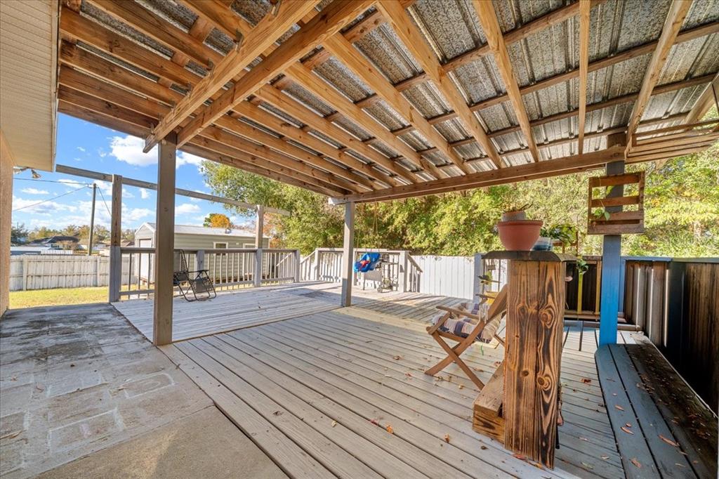 49 Hemlock Radial Loop Ocala, FL 34472 - Photo 36 of 50 a view of a patio with wooden floor