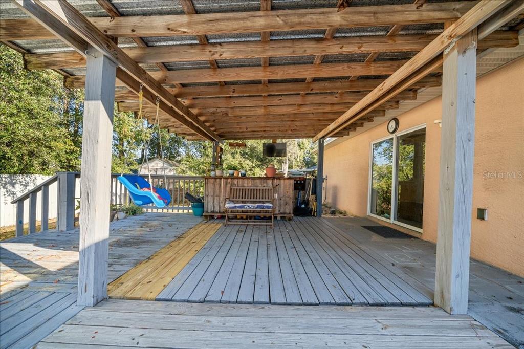 49 Hemlock Radial Loop Ocala, FL 34472 - Photo 37 of 50 a view of porch with wooden floor and outdoor space