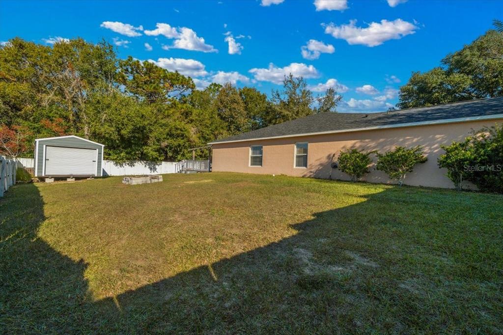 49 Hemlock Radial Loop Ocala, FL 34472 - Photo 43 of 50 a view of a house with a yard