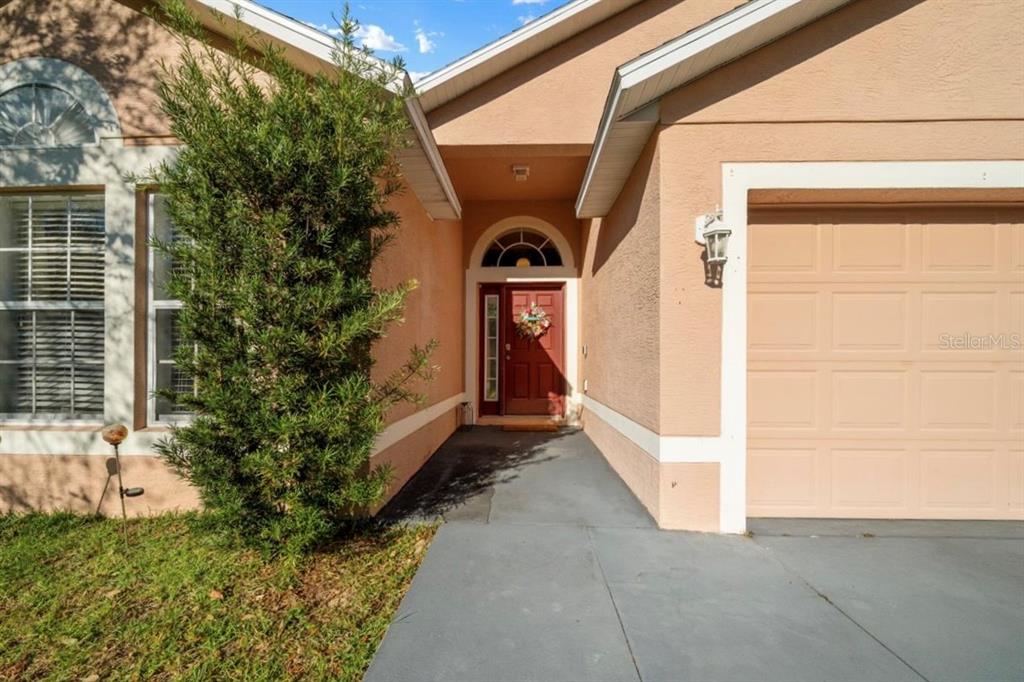 49 Hemlock Radial Loop Ocala, FL 34472 - Photo 5 of 50 a front view of a house with a yard