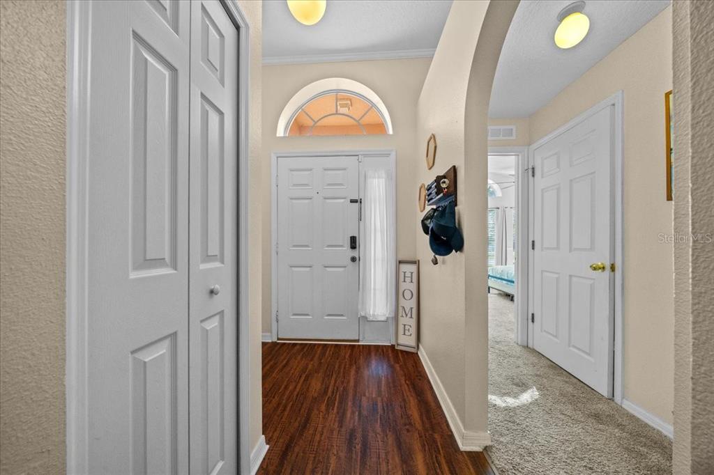 49 Hemlock Radial Loop Ocala, FL 34472 - Photo 7 of 50 a view of a hallway with wooden floor