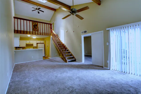 a view of an entryway with a front door