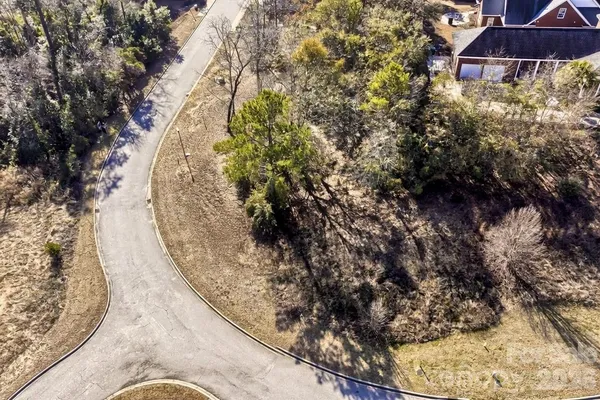 an aerial view of a residential house with a outdoor space