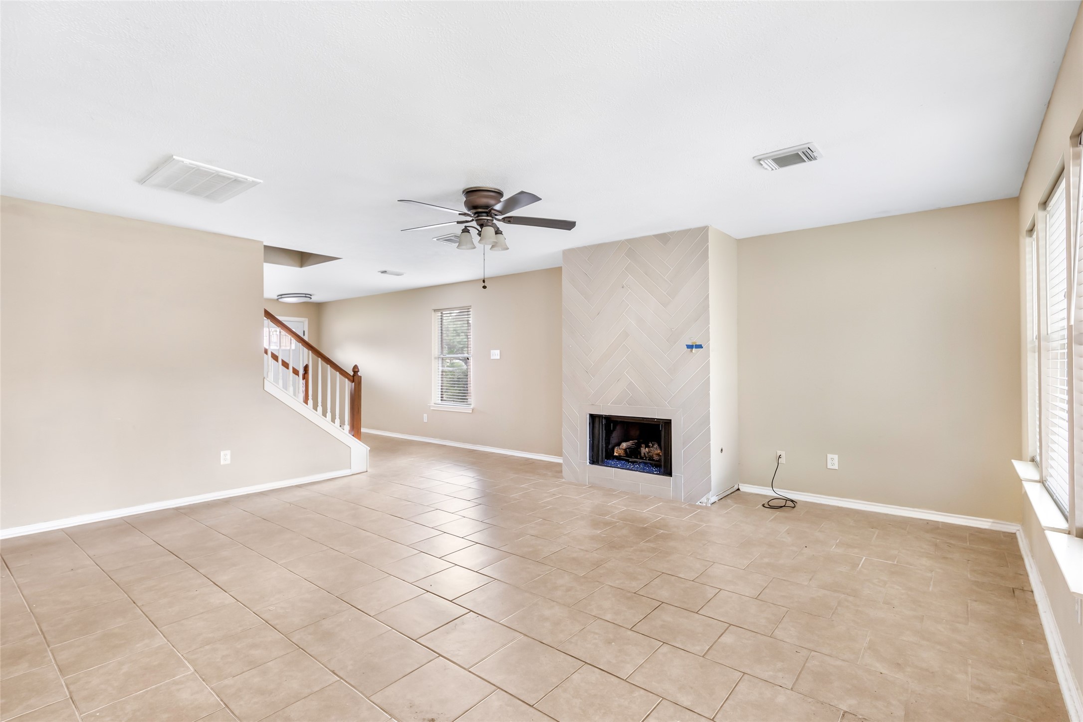 19226 Pinewood Mist Lane Humble, TX 77346 - Photo 15 of 33 a view of an empty room with a fireplace