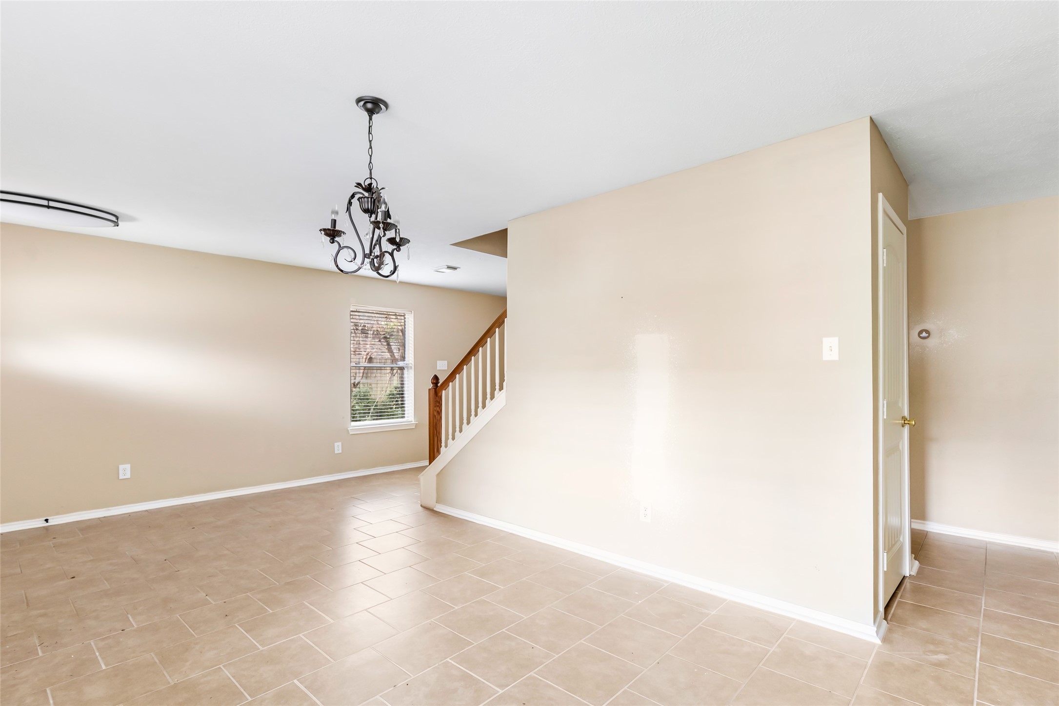 19226 Pinewood Mist Lane Humble, TX 77346 - Photo 20 of 33 a view of a hallway with a chandelier