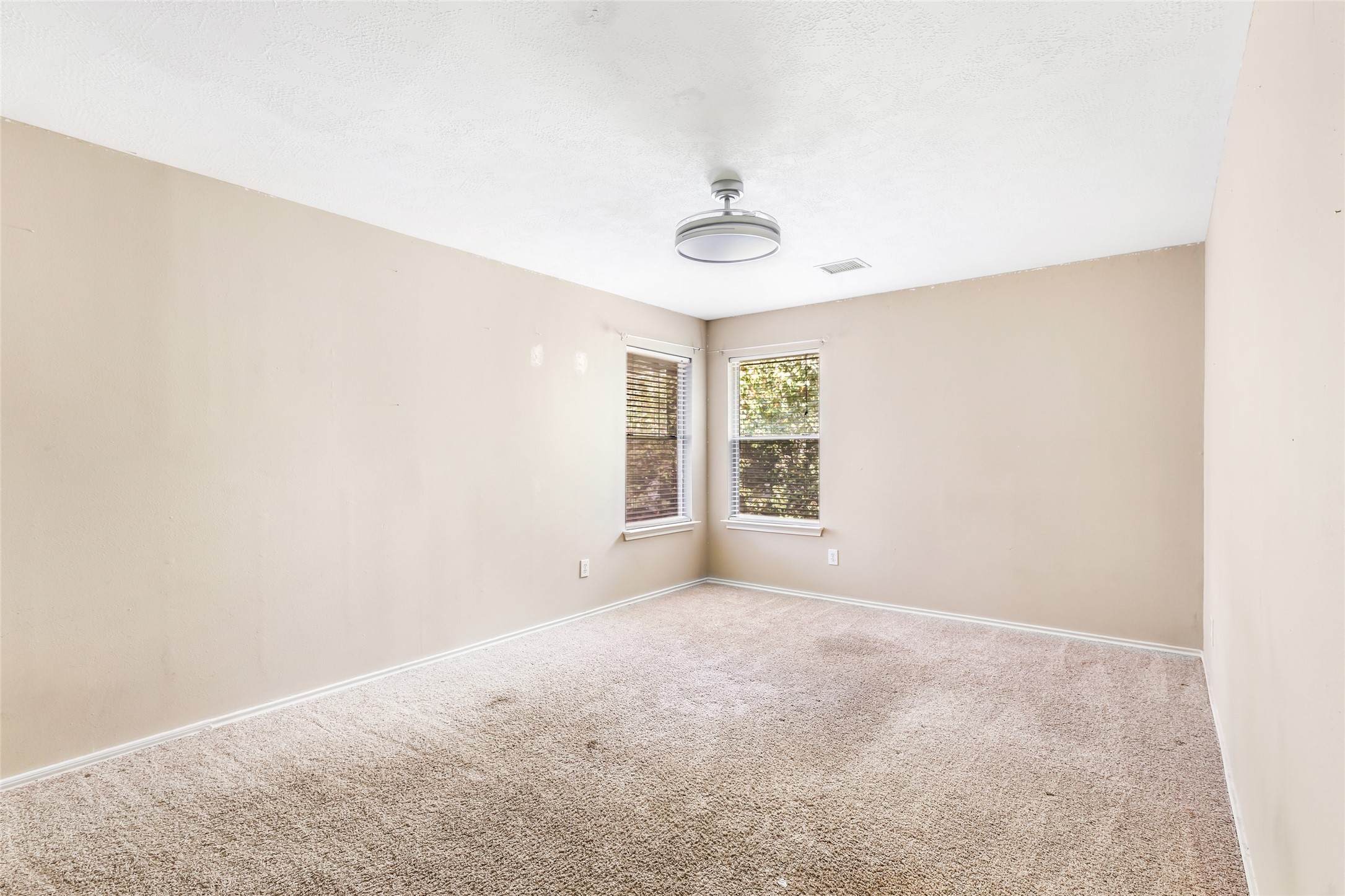 19226 Pinewood Mist Lane Humble, TX 77346 - Photo 24 of 33 an empty room with windows