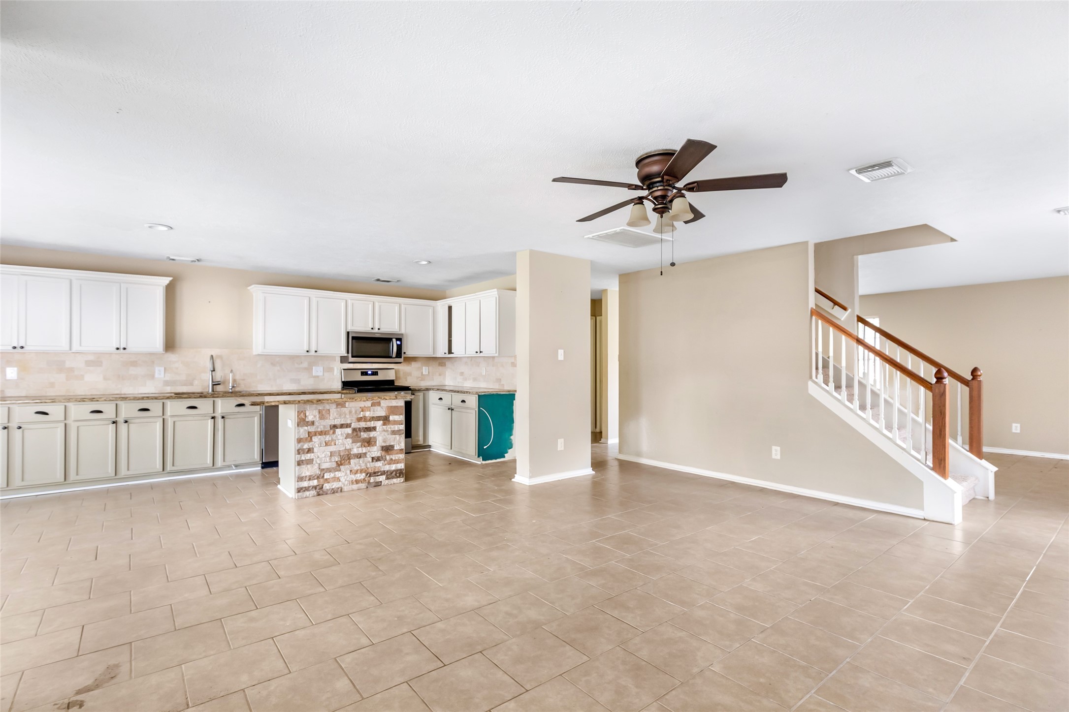 19226 Pinewood Mist Lane Humble, TX 77346 - Photo 8 of 33 a view of kitchen with furniture and a ceiling fan