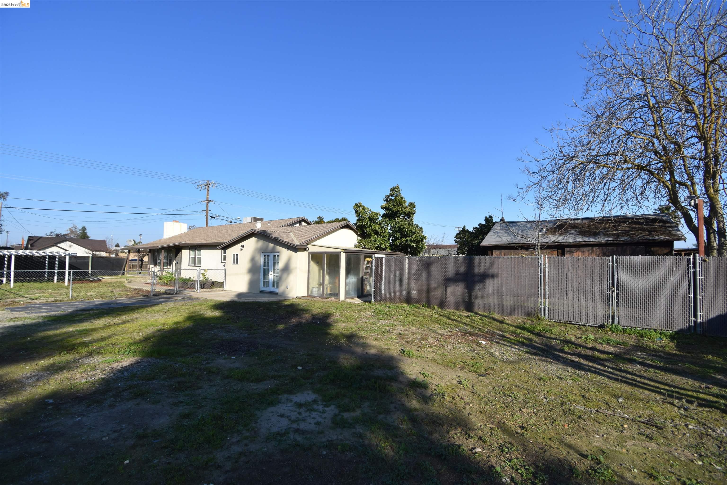 5100 Kiernan Avenue Salida, CA 95368 - Photo 15 of 45 a view of a yard with an house and a trees