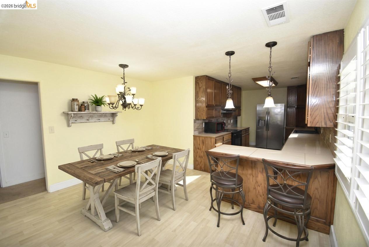 5100 Kiernan Avenue Salida, CA 95368 - Photo 22 of 45 a dining room with furniture and window