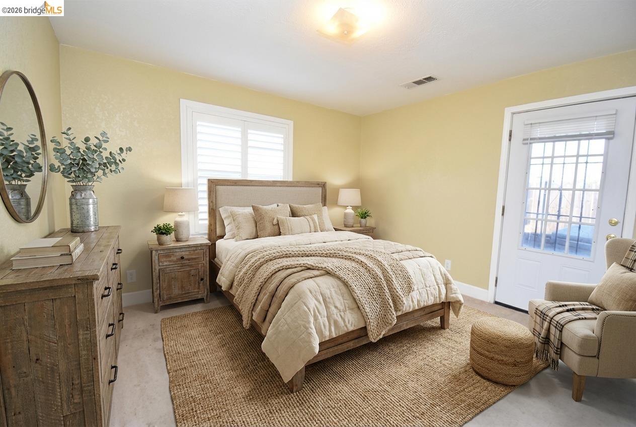 5100 Kiernan Avenue Salida, CA 95368 - Photo 25 of 45 a spacious bedroom with a bed a dresser mirror and a window
