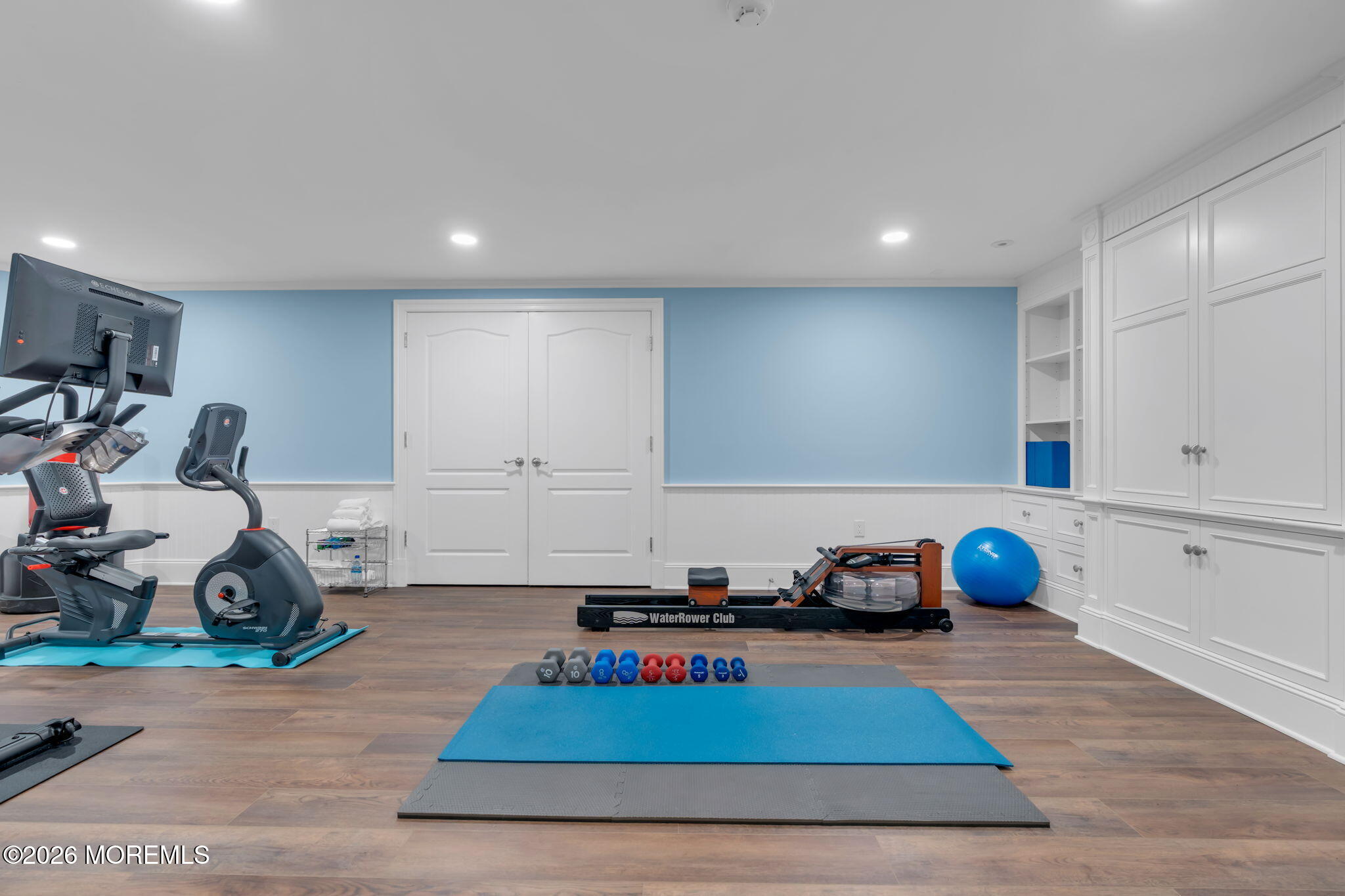 672 Winding River Road Brick, NJ 08724 - Photo 70 of 111 a room with gym equipment and wooden floor