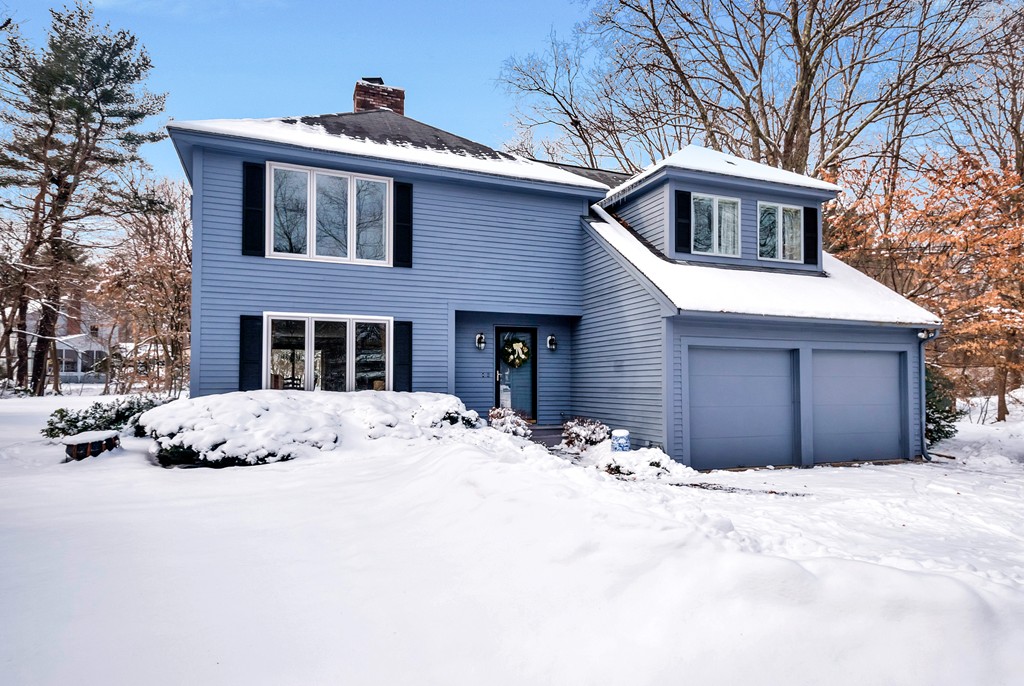 2 Kingman Road Acton, MA 01720 - Photo 1 of 28 a front view of a house with a yard covered in snow