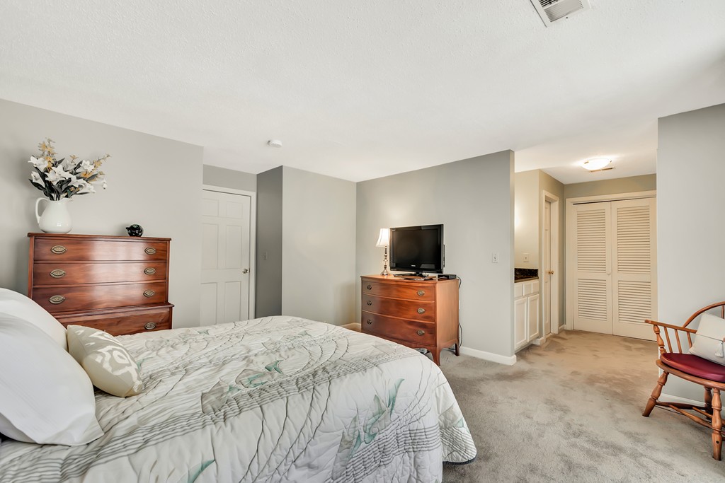 2 Kingman Road Acton, MA 01720 - Photo 14 of 28 a bedroom with a bed and a television
