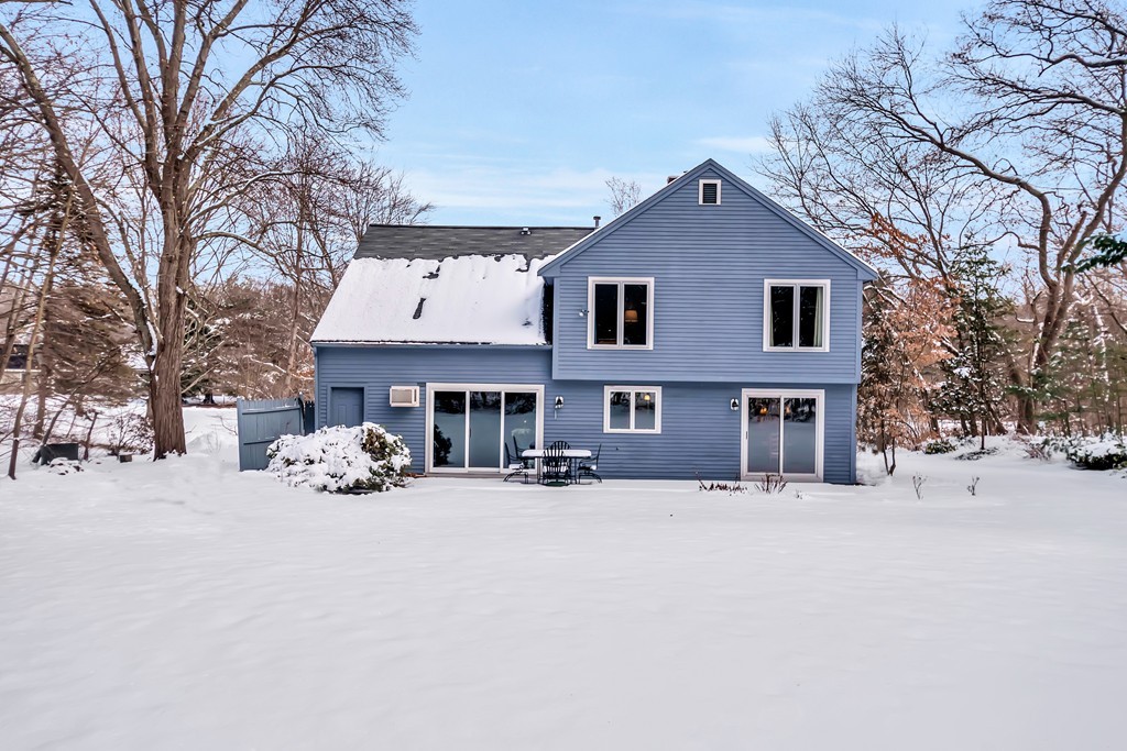 2 Kingman Road Acton, MA 01720 - Photo 22 of 28 a view of a house with a yard covered in snow