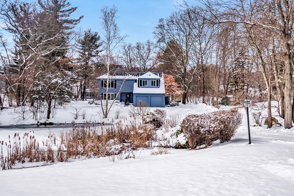 2 Kingman Road Acton, MA 01720 - Photo 24 of 28 a front view of a house with a yard covered with snow