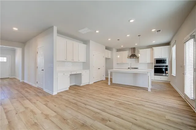 a view of kitchen view with cabinets and stainless steel appliances