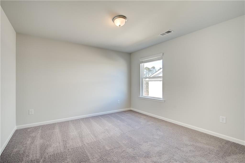 305 Exeter Court Stockbridge, GA 30281 - Photo 19 of 27 a view of an empty room with a window