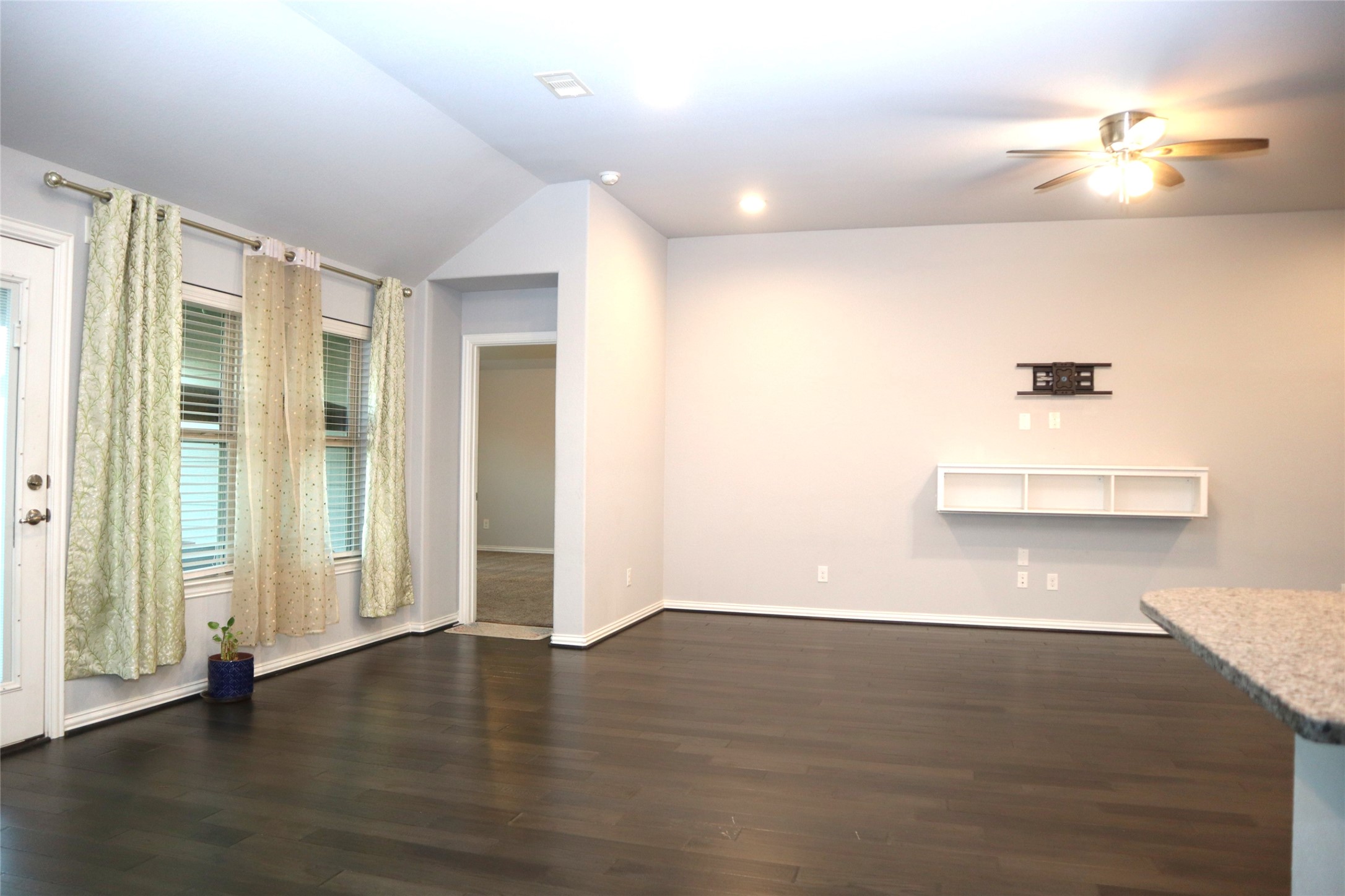 4553 New Country Drive Spring, TX 77386 - Photo 36 of 36 a view of an empty room with wooden floor and a window