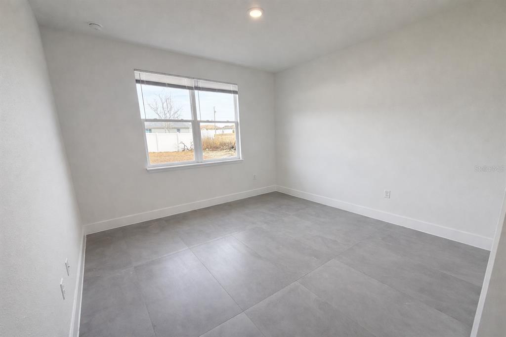 4837 Southwest 138th Lane Ocala, FL 34473 - Photo 19 of 24 an empty room with a window