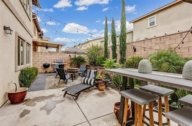 a view of balcony with chairs and potted plants
