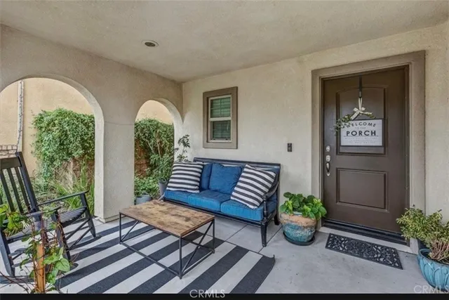a view of a room with porch and outdoor seating