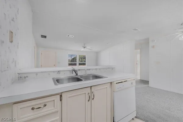 a kitchen with a sink and cabinets