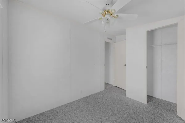 a view of a chandelier fan in a room