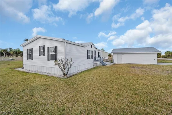 a front view of a house with garage
