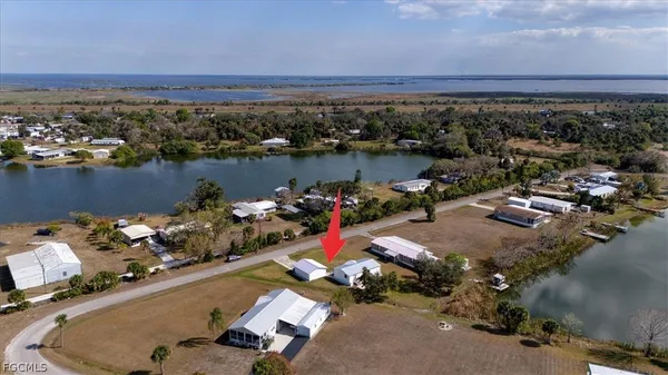 an aerial view of a residential houses with outdoor space
