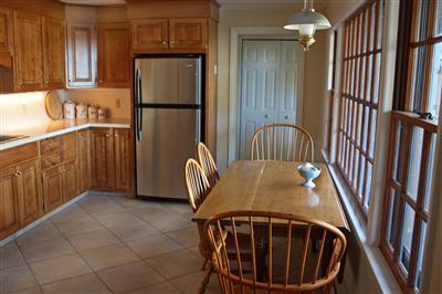 127 Old Salt Works Road Chatham, MA 02633 - Photo 4 of 10 a view of a kitchen with a sink and refrigerator