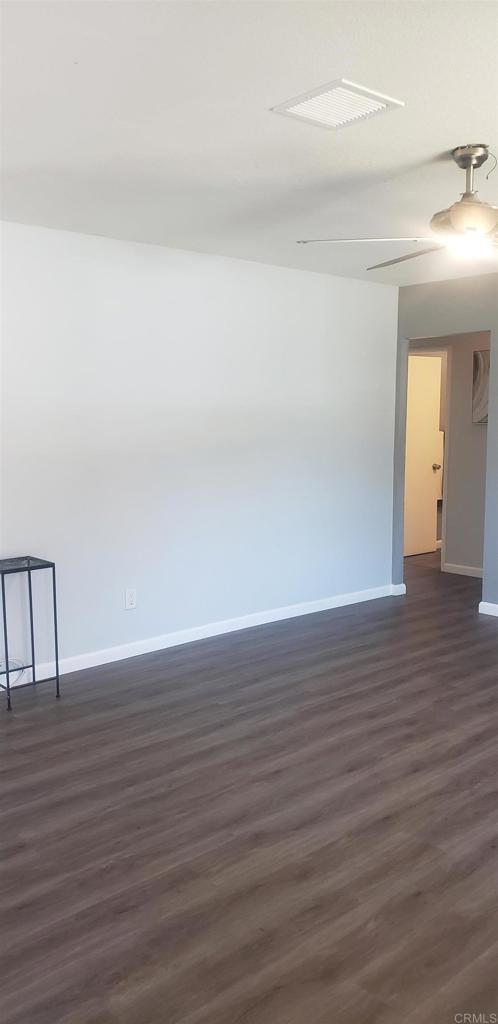 3011 Thunder Drive Oceanside, CA 92056 - Photo 14 of 28 a view of an empty room with wooden floor and a window