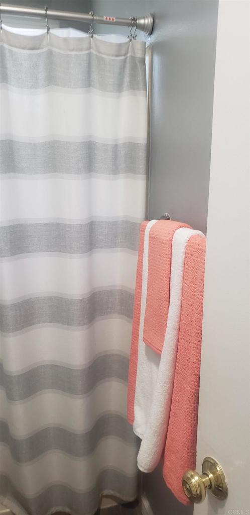 3011 Thunder Drive Oceanside, CA 92056 - Photo 21 of 28 a view of walk in closet with clothes and shoes