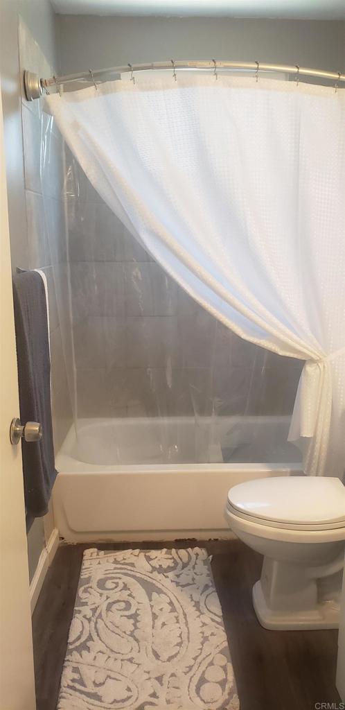 3011 Thunder Drive Oceanside, CA 92056 - Photo 24 of 28 a bathroom with a toilet and a bathtub