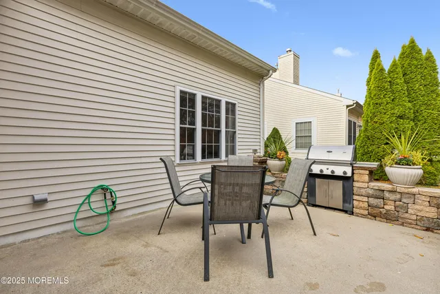 a view of a two chairs in the patio