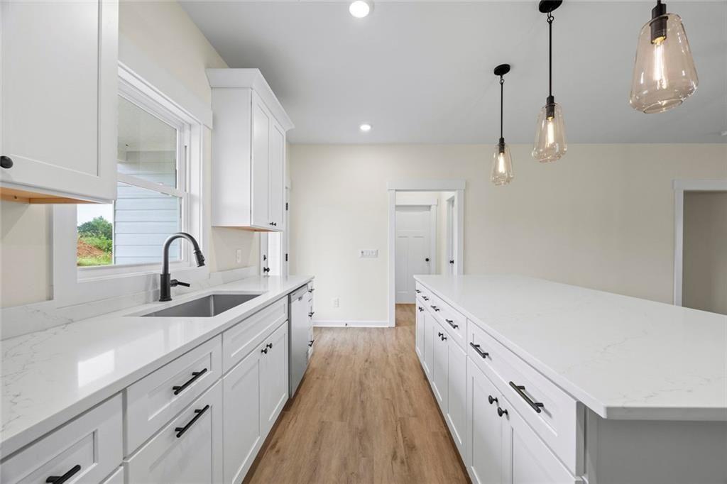 711 Racetrack Road Toccoa, GA 30577 - Photo 6 of 8 a spacious bathroom with a double vanity sink a and a shower