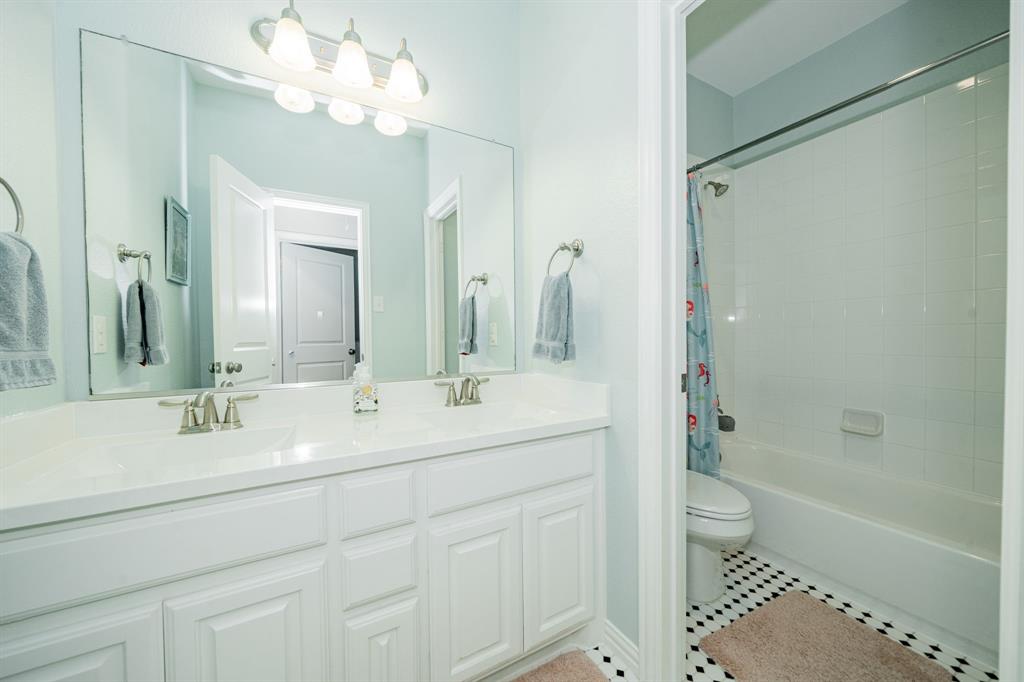 2023 Cutter Crossing Place Wylie, TX 75098 - Photo 10 of 33 a bathroom with a double vanity sink mirror double and shower