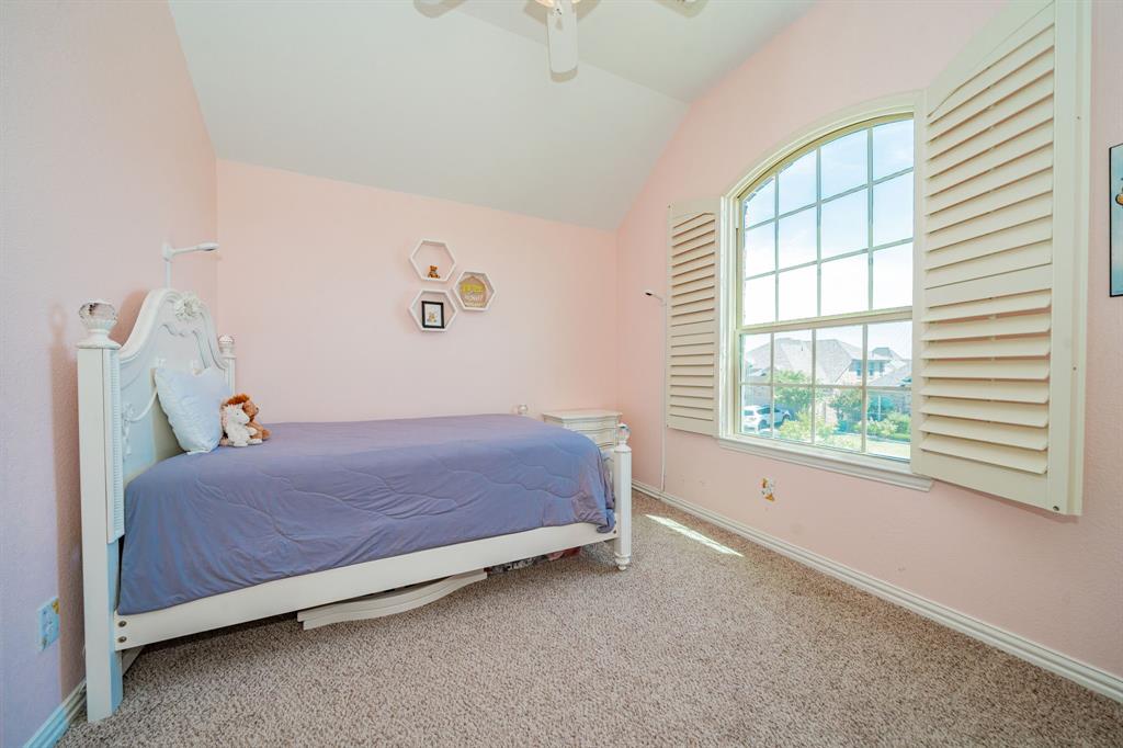 2023 Cutter Crossing Place Wylie, TX 75098 - Photo 11 of 33 a bedroom with a bed and a window