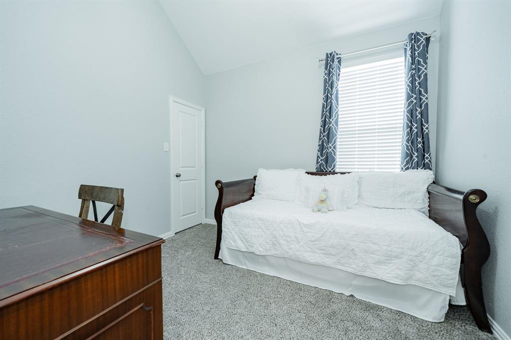 2023 Cutter Crossing Place Wylie, TX 75098 - Photo 13 of 33 a bedroom with a bed and a window