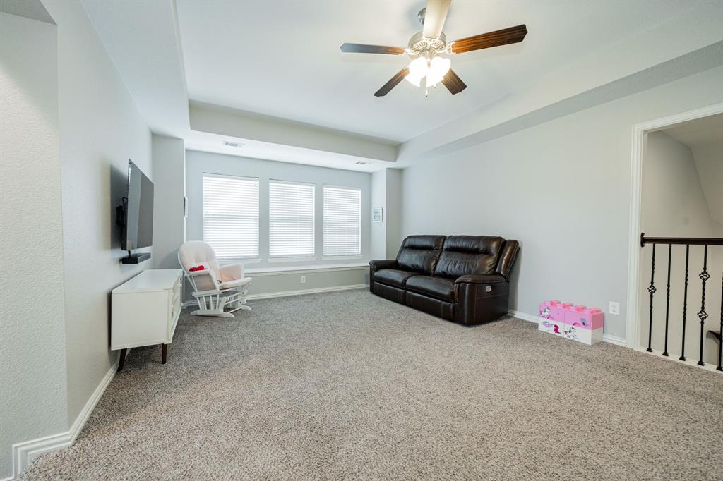 2023 Cutter Crossing Place Wylie, TX 75098 - Photo 14 of 33 a living room with furniture and a flat screen tv