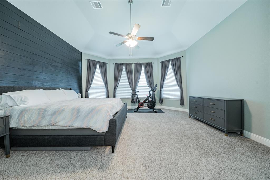 2023 Cutter Crossing Place Wylie, TX 75098 - Photo 20 of 33 a bed room with a bed and a window