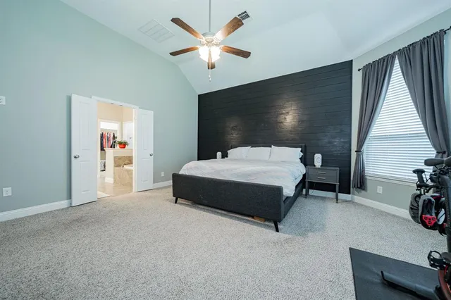 a bed room with a bed and a window